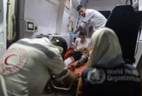 Medical-teams-provide-urgent-care-to-an-injured-child-inside-an-ambulance-with-support-from-WHO-and-the-oPt-Red-Crescent-Society